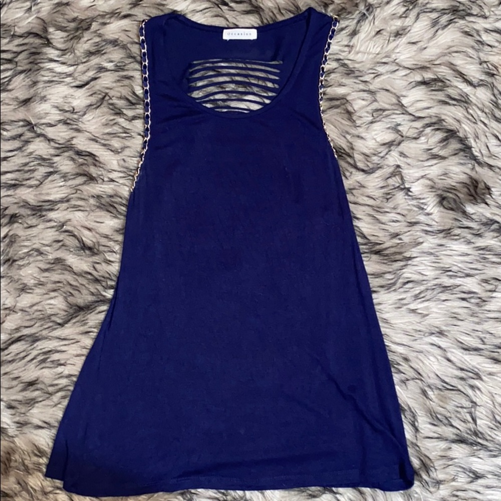 Blue tank top with chain going around arms